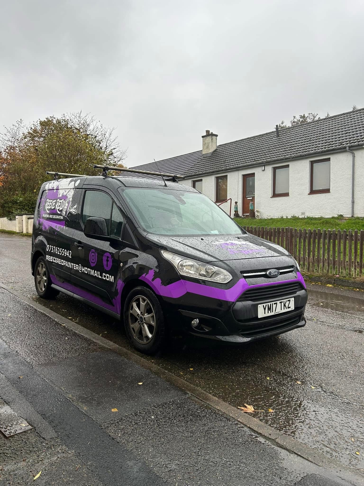 Completed Reece Reid branded van photographed on the road